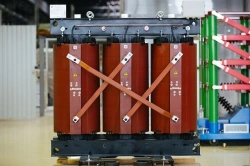 Three-phase dry-type power transformer with moulded insulation.