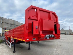 Semitrailer Politrans 9417-021. In the version: metal platform with decking, with sides, with racks (cones), with modulator.
