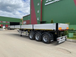Three-axle flatbed semi-trailer model PL-24 of modification PL-24B with axle unit BPW HSFALM 9010-15 V36 61.68.361.147QS and wit