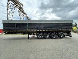 Tipper semi-trailer with side dump body type 85338, modification 853383. Metal tipper body of square cross-section with tipping.