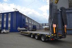 Semitrailer Politrans 94183-010. In the version: metal platform with a loading platform, with ladders, with cones, with a flatbe
