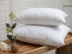Pillows of cotton fabrics with filling of synthetic and mixed fibres