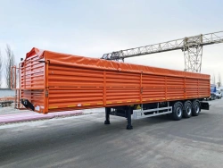 Tipper semi-trailer with side dump type 85333, modification 853333. Metal tipper body of square cross-section with tipping.