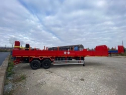 Semitrailer Politrans 9417-0000010. In version: metal platform with decking, with spring suspension.
