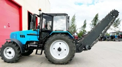 Machines for road and municipal services UDKM-7 on the basis of wheeled tractor Belarus 1221.3, with attachment: mouldboard y