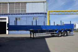 Semitrailer Politrans 9417-030. In design: metal platform with decking, with sides, with cones on spring suspension. On