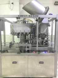 Automatic line, capacity up to 4000 bottles/hour for PET and glass containers, capacity up to 2 litres, consisting of: YUWEST-UP