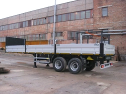 Two-axle semitrailer flatbed trailer model PT-18 of PT-18B modification with axle unit BPW HSFALM 9010-15 V36 61.68.361.147QS, w