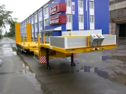 Semitrailer-heavy hauler Politrans 94184-060. In version: metal sliding platform with a loading platform, with ladders, with a f