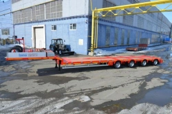 Semitrailer-heavy hauler Politrans 94184-089. In the version of metal sliding platform with a loading platform, with ladders, wi