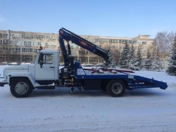 Tow truck with crane-manipulator unit (CMU) of INMAN JSC production type 47121, modification 47121G on the chassis base.