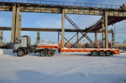 Semitrailer-heavy hauler Politrans 94163-031. Wheel axle "Plant" 1201-2410002. Tyre 385/65R22,5. In version: platform with strai