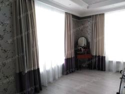 Curtain with two-tone trimming