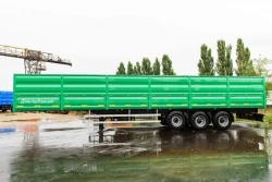 Semitrailer grain carrier type 85333, modification 853331. Metal flatbed flatbed with front fixed side, rear and lateral sides.