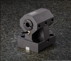 Stationary mandrel for CNC machines