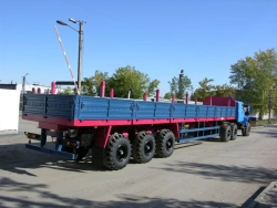 Semitrailer Politrans 94171-040. In version: metal platform with decking, with sides, with stands (cones) with spring pneumatic