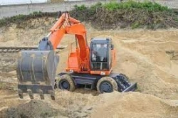 Single-bucket wheeled excavator E185W with hydraulic motor of stroke 303.4.112.501 produced by PSM, a.s.