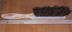Natural bristle brush with plastic cover