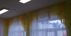Lambrequin on a rigid base with lining, complex form with decorative drapes, double-sided, the upper part in the form of an arch