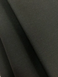 Heat-resistant fabric made of synthetic fibre yarns with flame-retardant, anti-electrostatic and oil and water-repellent propert
