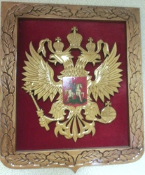 Coat of arms of the Russian Federation carved of wood with velvet trimming